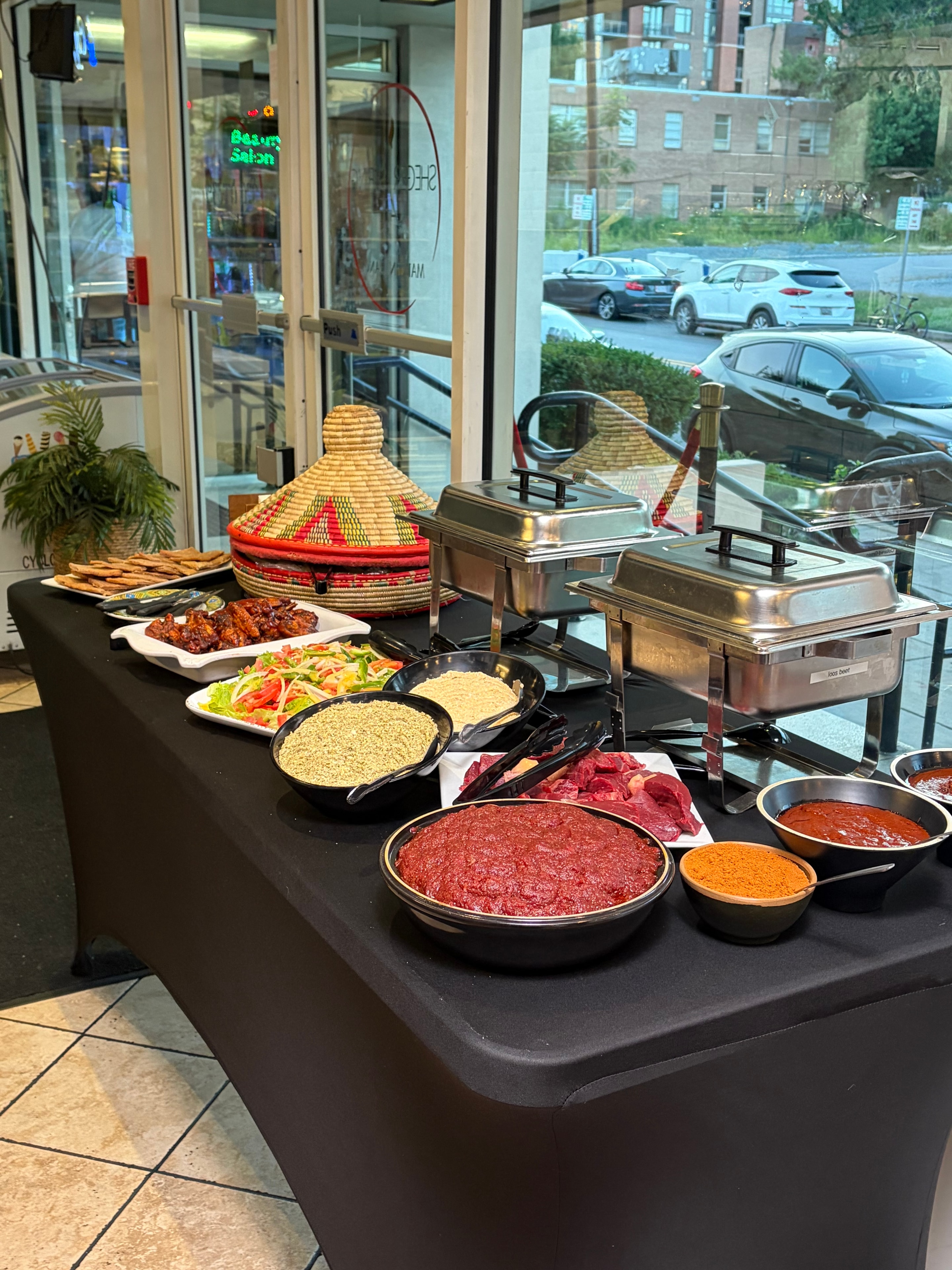 Ethiopian catering spread with traditional dishes and tableware